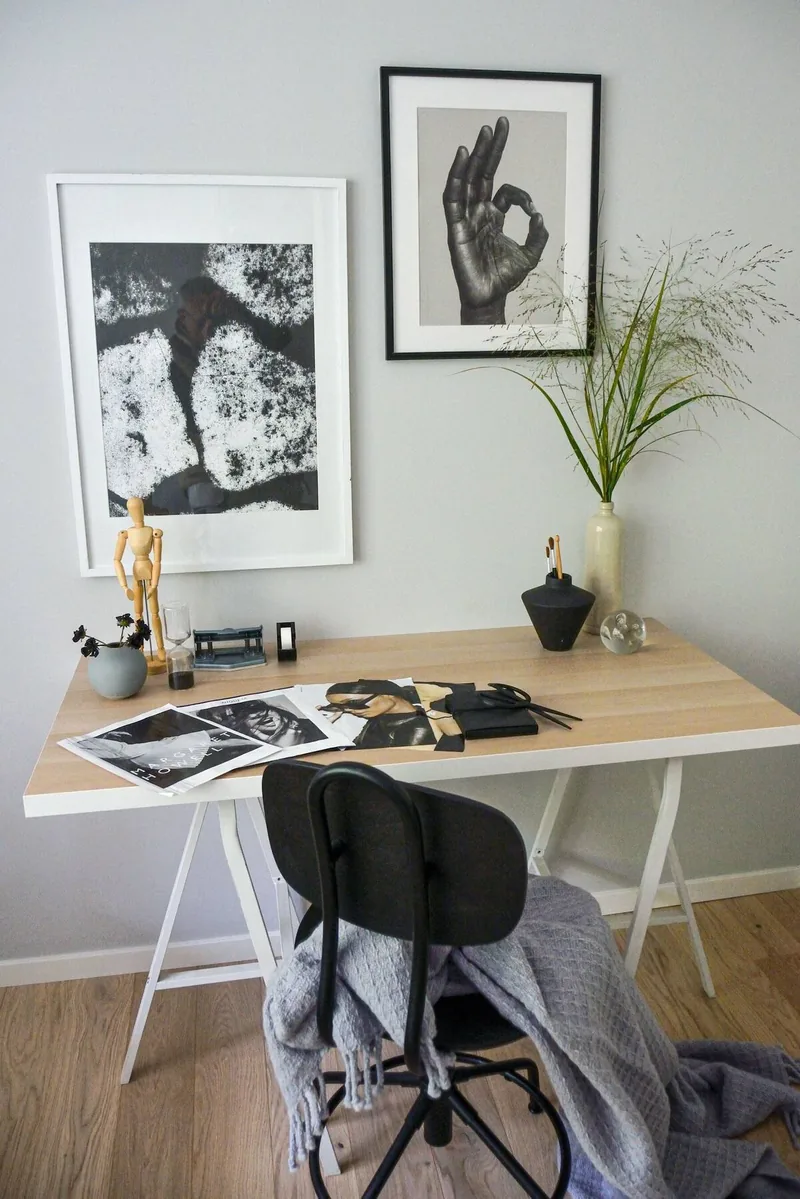 A quiet desk with a laptop and morning light
